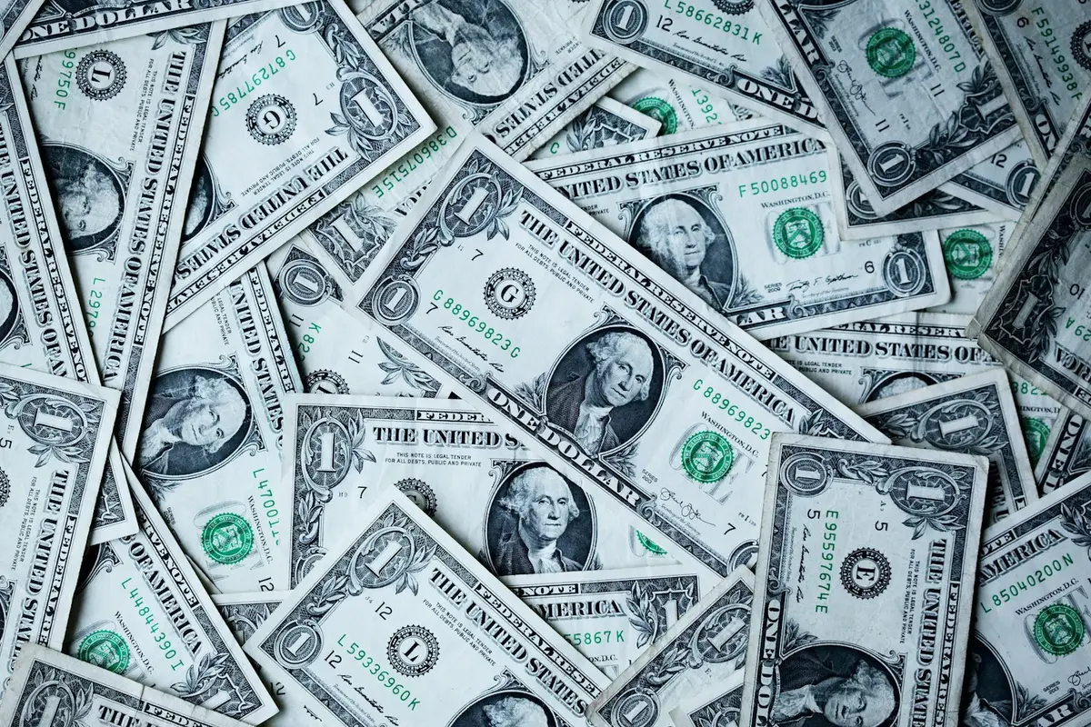 Fanned-out US dollar bills representing cash income and cashflow